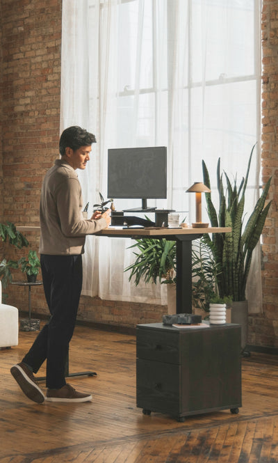 Perk Height-Adjustable Desk in lifestyle shot