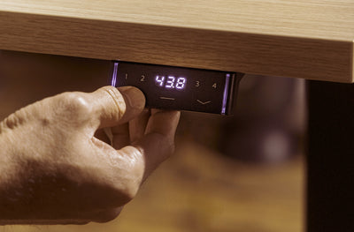 Perk Height-Adjustable Desk in lifestyle shot